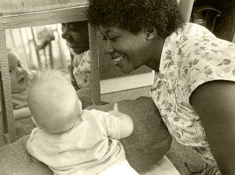 Baby looking at a mirror